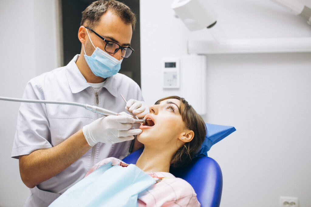 Dentist curing a Patient
